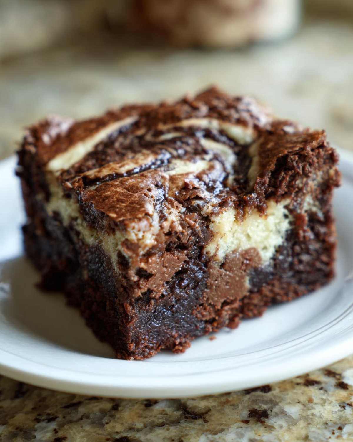 A rich, fudgy square of Cottage Cheese Microwave Brownie featuring a beautiful chocolate and cream cheese swirl topping.