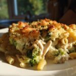 Close-up of a serving of Cheesy Chicken and Broccoli Pasta Bake with a golden, crunchy breadcrumb topping.